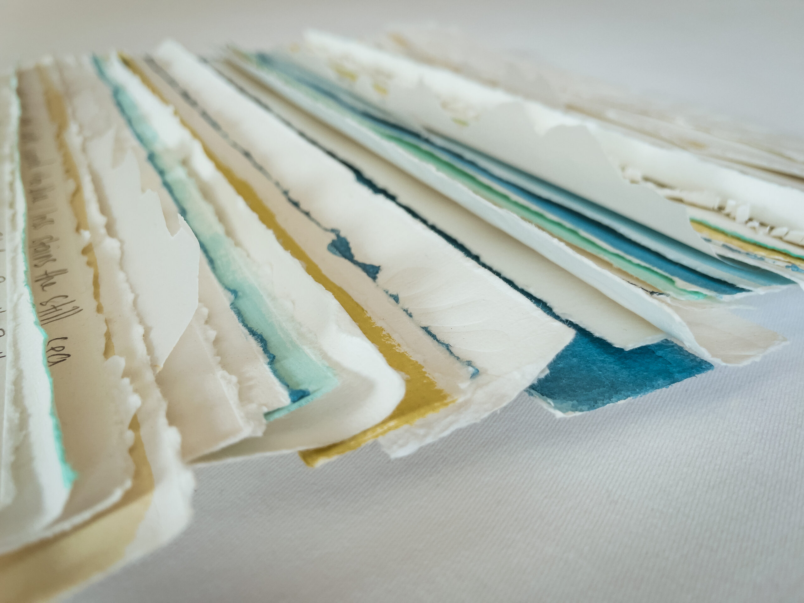 Veil of Erasure, paper sculpture installation with 135 white lamellae against crimson backing, by Stephen Russell-Brett